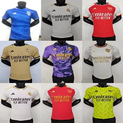 Nine football shirts in blue, white, red, purple and yellow, arranged in three rows